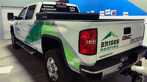 Fully branded construction company fleet pickup truck with full vehicle wrap