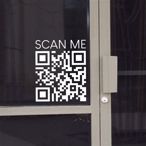 Large Scan Me QR code window sticker on a glass storefront door