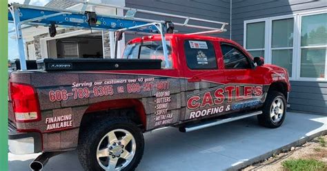 Red roofing contractor pickup truck with full vehicle graphics